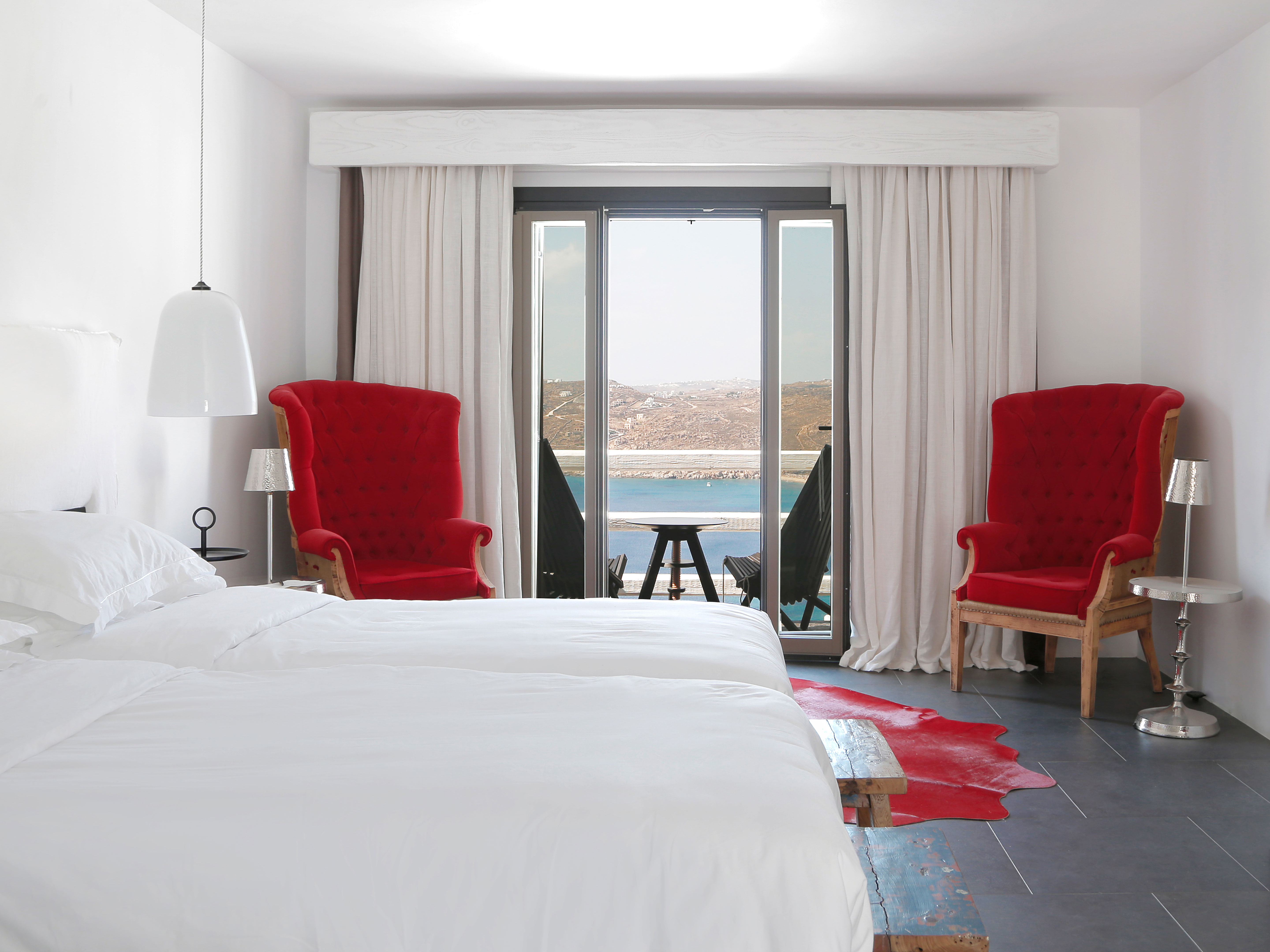 Myconian Avaton Red Chairs Detail in Mykonos